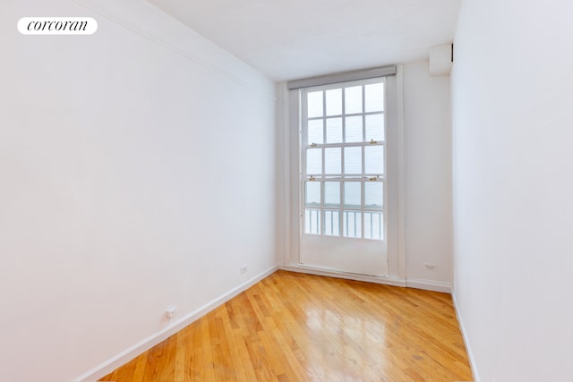 spare room featuring light hardwood / wood-style flooring