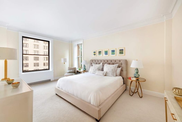 bedroom featuring light carpet, baseboards, and crown molding