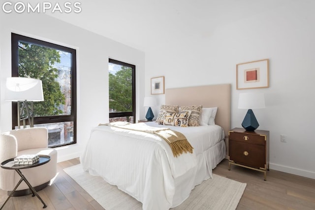 bedroom with hardwood / wood-style floors