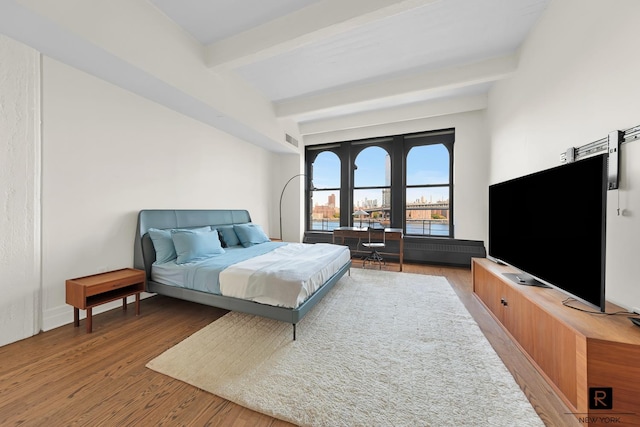 30 Main St Unit 11-G, New York City, NY 11201 - bedroom featuring beamed ceiling and wood finished floors