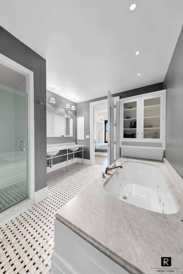 30 Main St Unit 11-G, New York City, NY 11201 - bathroom featuring baseboards, a tub with jets, a stall shower, and recessed lighting