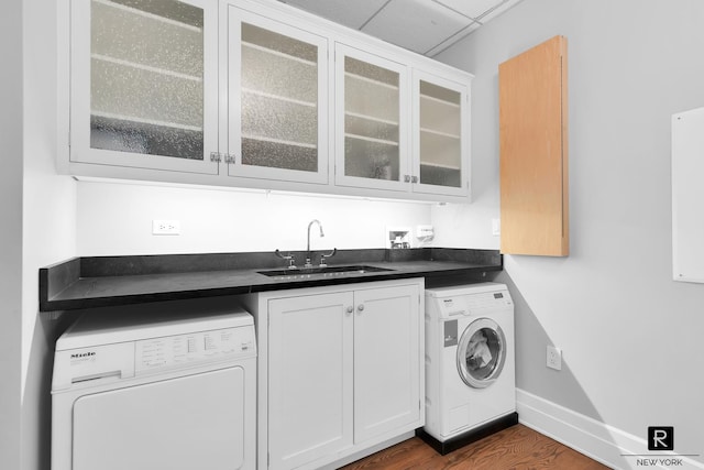30 Main St Unit 11-G, New York City, NY 11201 - washroom with washer / clothes dryer, wet bar, cabinet space, and baseboards