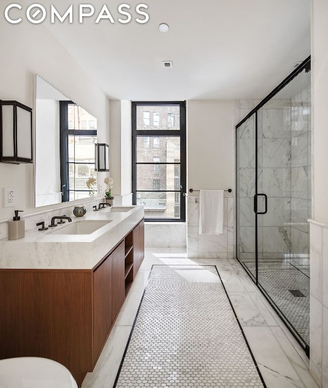 bathroom with vanity and walk in shower