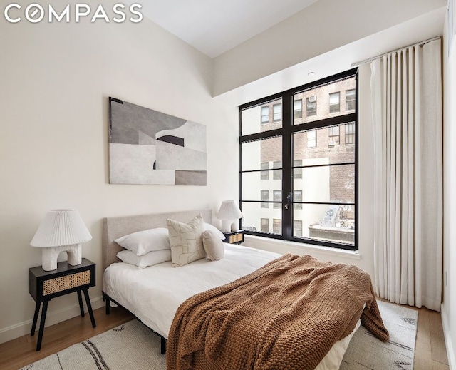 bedroom featuring wood-type flooring