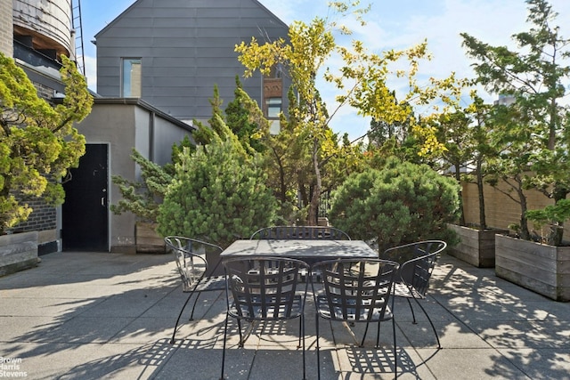 view of patio with outdoor dining area