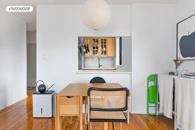 home office with sink and hardwood / wood-style floors