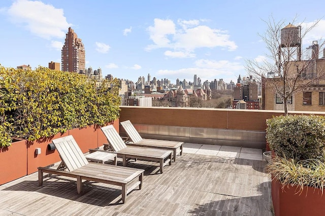 wooden deck with a view of city