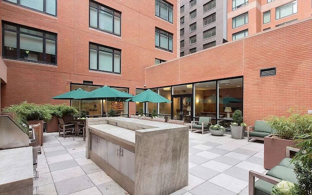 view of patio featuring an outdoor kitchen