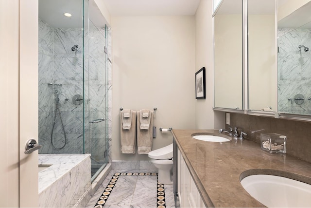 bathroom with a marble finish shower, marble finish floor, toilet, and a sink