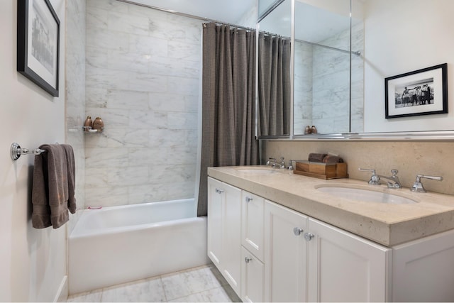 full bathroom featuring double vanity, shower / bath combo, and a sink