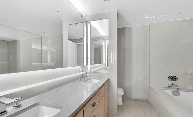 170 E End Ave Unit 2G, New York City, NY 10128 - bathroom featuring double vanity, a sink, toilet, and a washtub