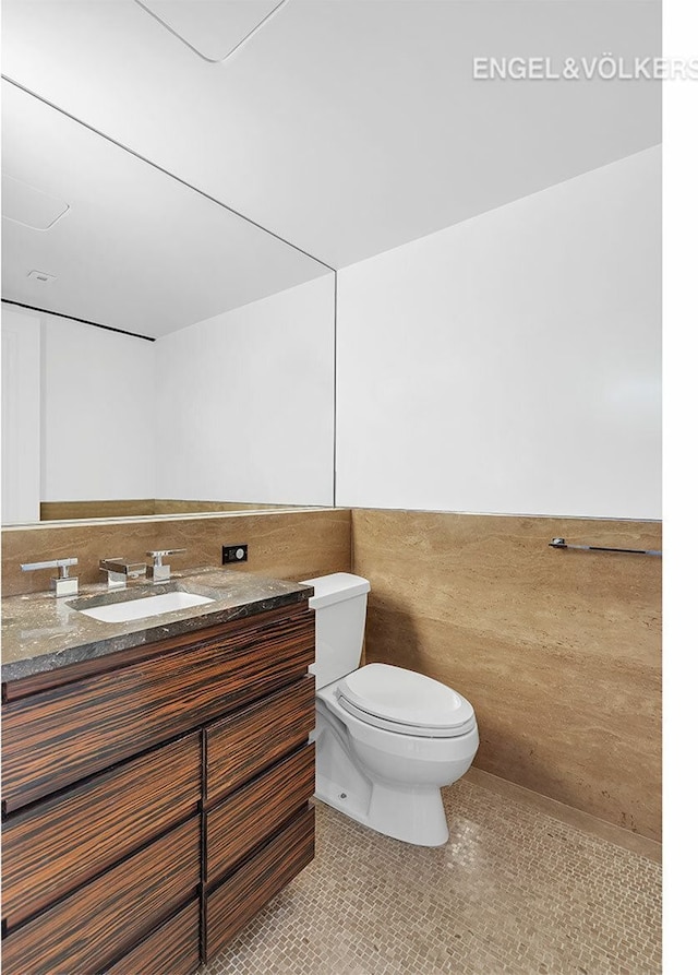 170 E End Ave Unit 2G, New York City, NY 10128 - half bath featuring tile patterned flooring, toilet, and vanity