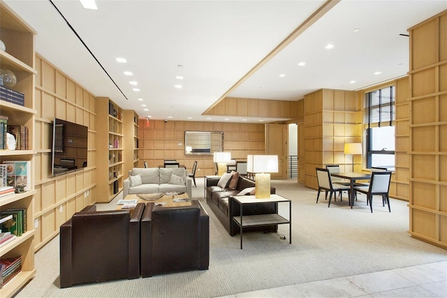 170 E End Ave Unit 2G, New York City, NY 10128 - living area featuring light tile patterned floors, built in features, recessed lighting, and light colored carpet