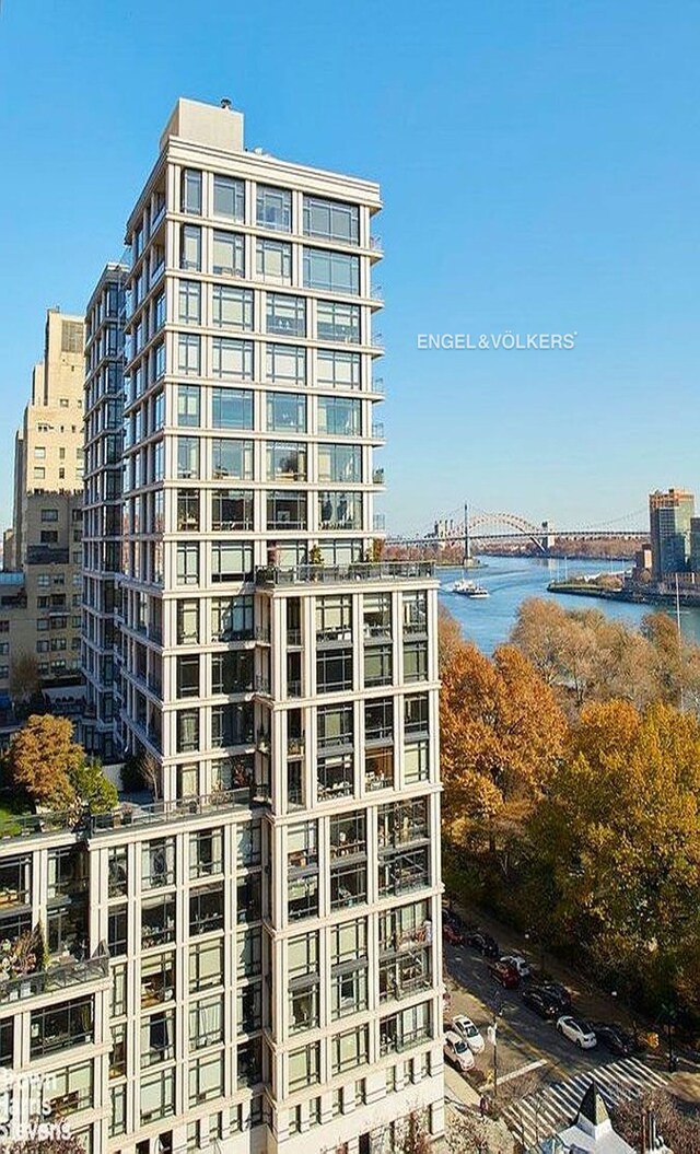 170 E End Ave Unit 2G, New York City, NY 10128 - view of building exterior with a view of city and a water view