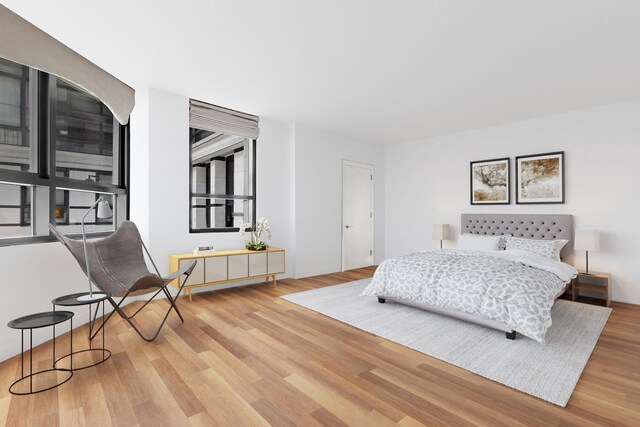 170 E End Ave Unit 2G, New York City, NY 10128 - bedroom featuring baseboards and wood finished floors