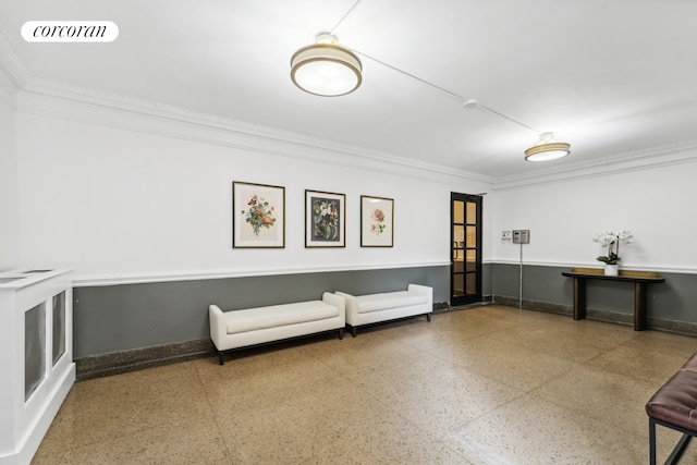 unfurnished room featuring baseboards, visible vents, and ornamental molding