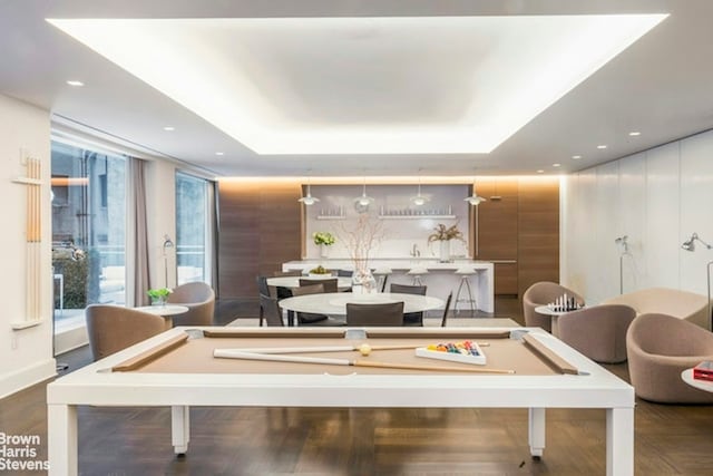 playroom with a raised ceiling, billiards, and dark wood-type flooring