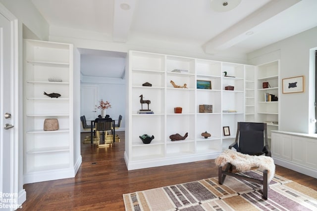 sitting room featuring dark hardwood / wood-style floors and beamed ceiling