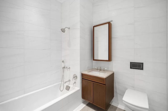 bathroom with bathing tub / shower combination, tile walls, vanity, and toilet