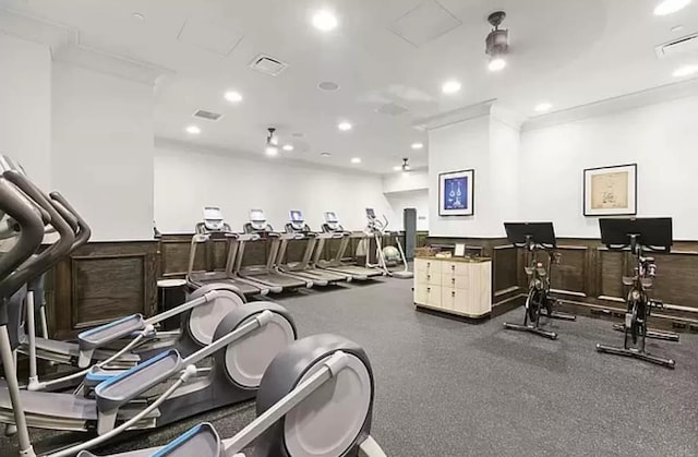 workout area with recessed lighting, visible vents, and wainscoting