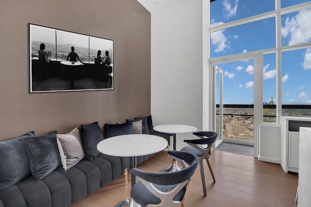 living area with hardwood / wood-style floors and floor to ceiling windows