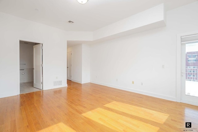 empty room featuring hardwood / wood-style floors