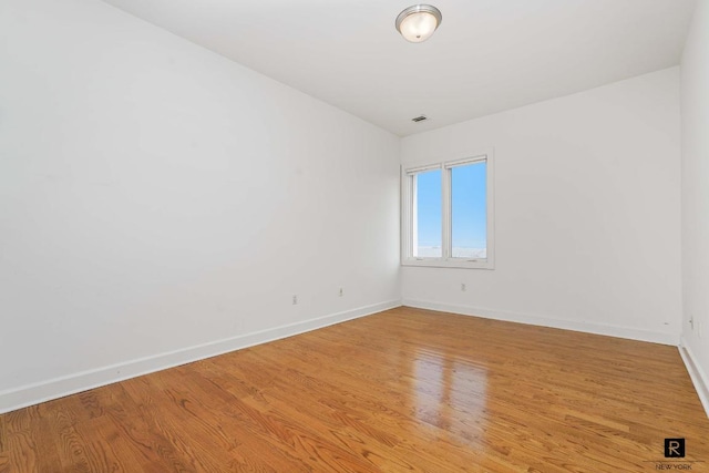 unfurnished room featuring light hardwood / wood-style flooring