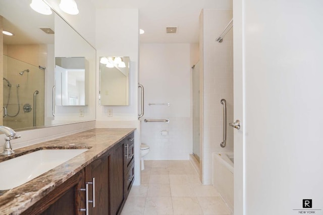 bathroom with vanity, tiled shower, tile walls, and toilet