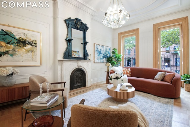 living room featuring parquet floors and a notable chandelier