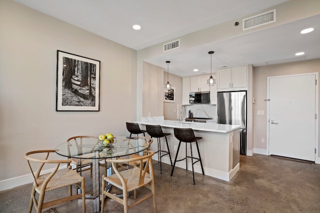 dining space featuring sink