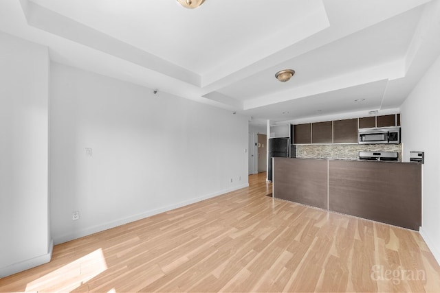 unfurnished living room featuring light wood-type flooring