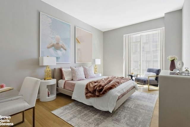 bedroom with wood finished floors