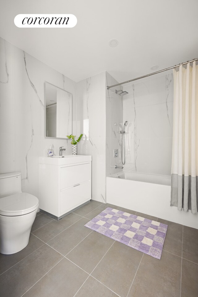 bathroom with vanity, shower / tub combo, tile patterned flooring, and toilet