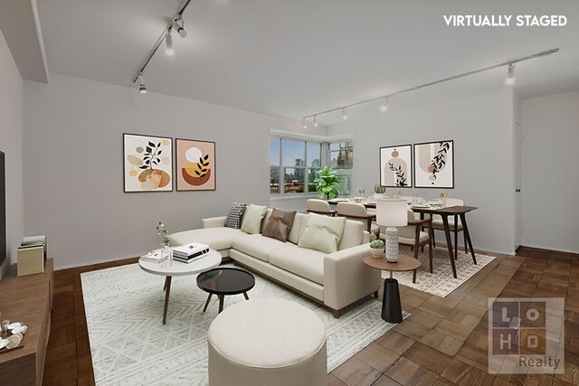 living room featuring parquet floors