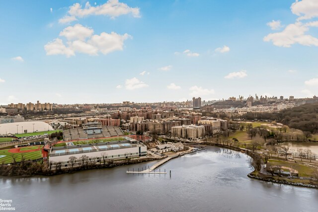 bird's eye view featuring a view of city and a water view