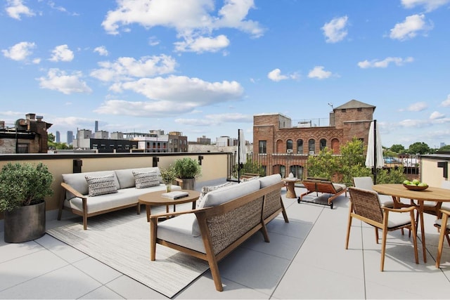 view of patio with an outdoor hangout area and a balcony