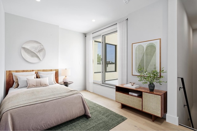 bedroom featuring recessed lighting and light wood-style floors