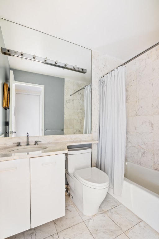 full bathroom with toilet, vanity, and shower / bath combo with shower curtain