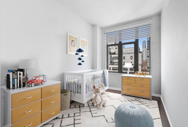 bedroom with hardwood / wood-style flooring