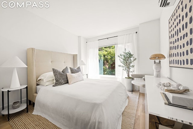 bedroom featuring hardwood / wood-style flooring