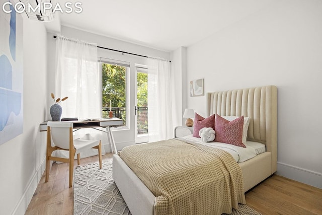 bedroom with hardwood / wood-style flooring