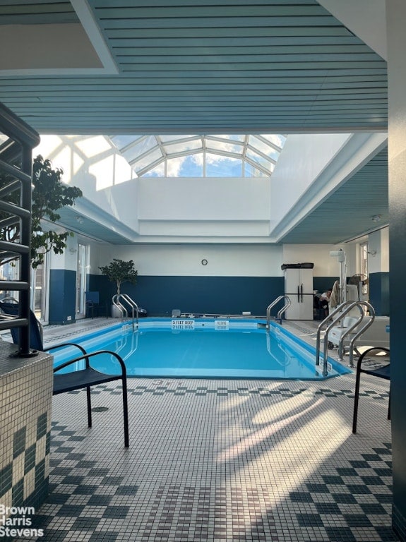 view of pool with a lanai and a patio