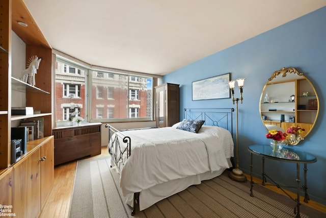 bedroom with light hardwood / wood-style flooring