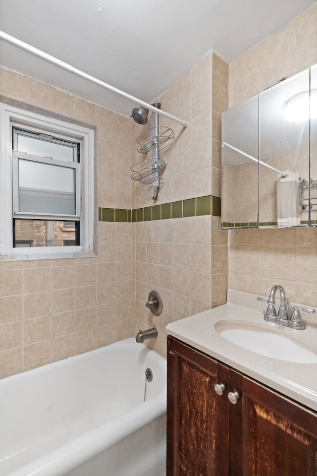 bathroom with tile walls, shower / bath combo, vanity, and decorative backsplash