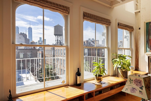 sunroom / solarium with a city view and a healthy amount of sunlight