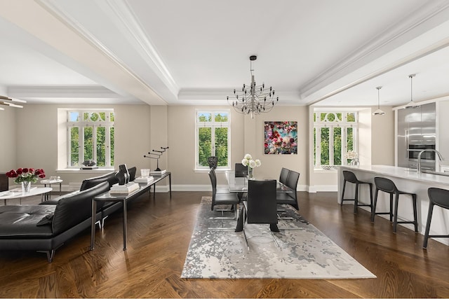 dining room with a raised ceiling, a chandelier, baseboards, and crown molding