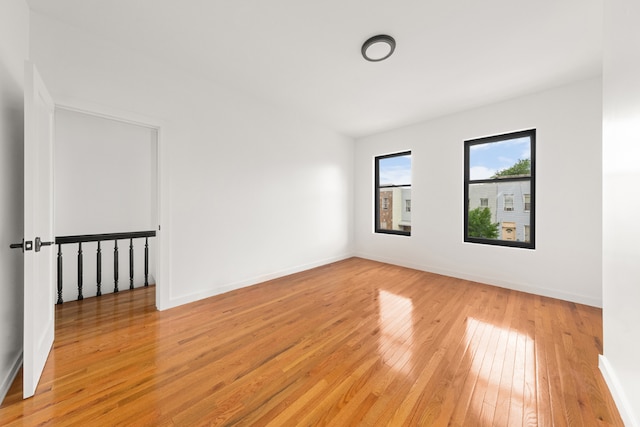 unfurnished room featuring light hardwood / wood-style floors