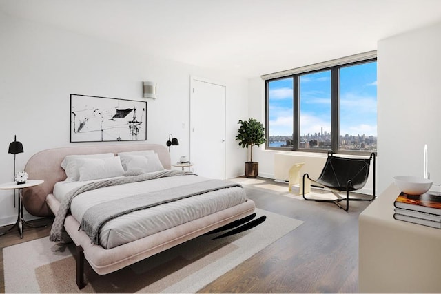 bedroom with wood-type flooring