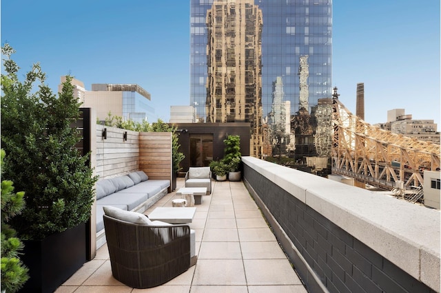 401 E 60th St Unit 5F, New York City, NY 10065 - balcony with an outdoor hangout area and a city view