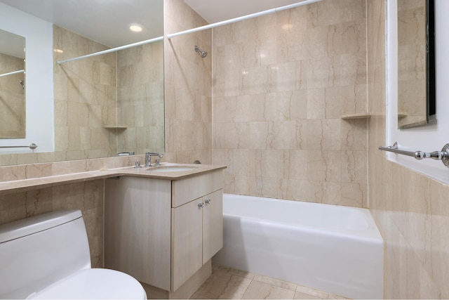 401 E 60th St Unit 5F, New York City, NY 10065 - bathroom with toilet, washtub / shower combination, vanity, tile walls, and tile patterned floors